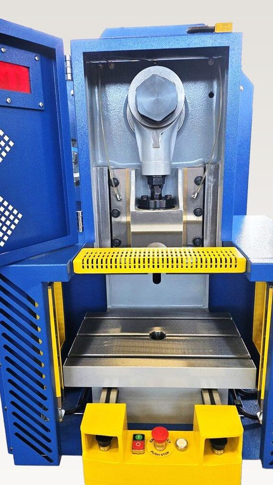 Fresan FP 10P eccentric press with the front guard open, exposing the ram, slides, eccentric drive mechanism and work table.