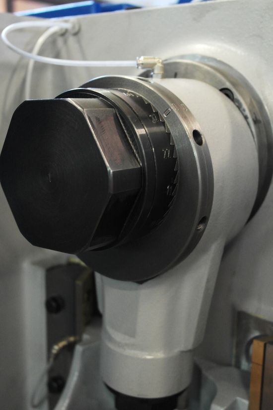 Close-up of the eccentric sleeve adjustment mechanism on a Fresan FP 10P press.