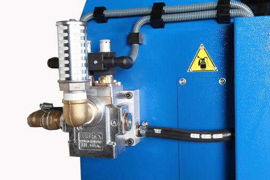 Close-up of the press safety valve and silencer mounted on a Fresan FP 10P press.