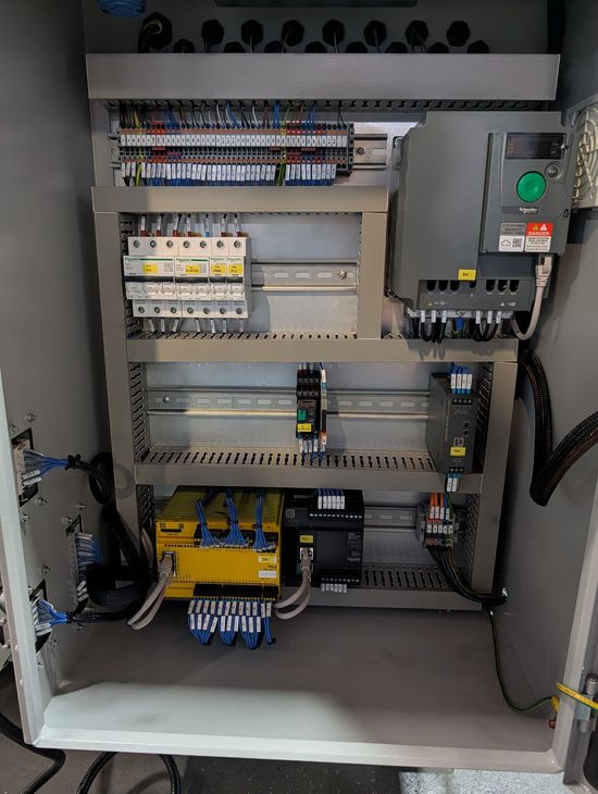 Open electrical control cabinet on a Fresan FP 60P eccentric press, showing terminal blocks, circuit breakers, AC drive, PLC and safety module.
