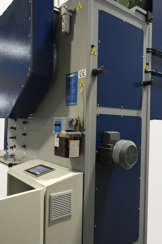 Close-up of the ram adjustment motor, automatic lubricator and control panel touchscreen on a Fresan FP 100P press.